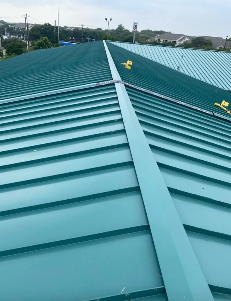 Green commercial metal roof ridge and valley for Metal Roof Repair in Minneapolis