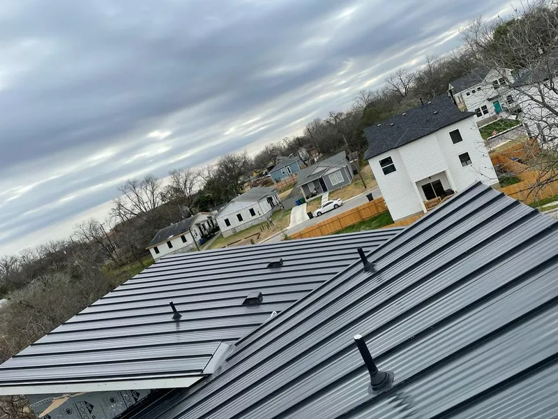 Standing seam metal roof panels with vents for Skylight Repair in Minneapolis